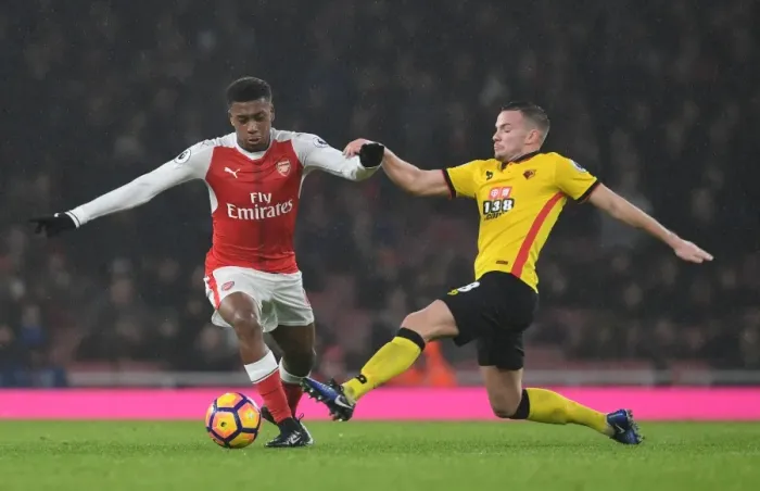 Framed Print : Intense Rivalry: Iwobi vs. Cleverley in Arsenal vs. Watford Premier League Showdown
