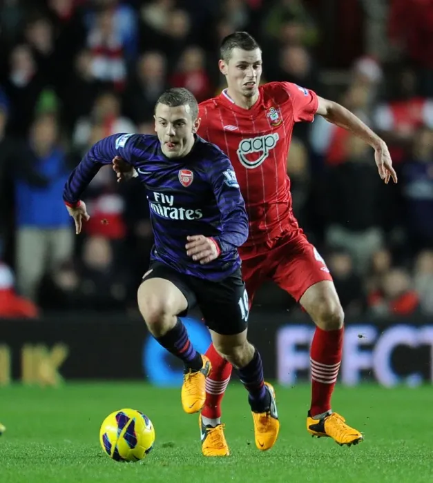 Framed Print : Intense Rivalry: Jack Wilshere vs Morgan Schneiderlin, Southampton vs Arsenal (2012-13) Framed Print : Intense Rivalry: Jack Wilshere vs Morgan Schneiderlin, Southampton vs Arsenal (2012-13)