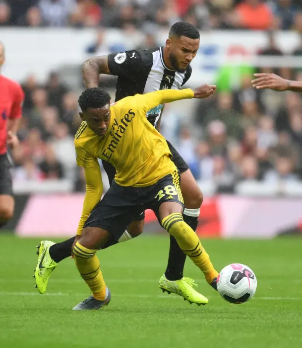 Framed Print : Intense Rivalry: Joe Willock vs Jamaal Lascelles Battle - Arsenal FC vs Newcastle United Premier League Clash Framed Print : Intense Rivalry: Joe Willock vs Jamaal Lascelles Battle - Arsenal FC vs Newcastle United Premier League Clash