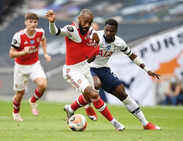 Intense Rivalry: Lacazette Fouls Aurier in Premier League Showdown (Tottenham vs. Arsenal, 2019-20)