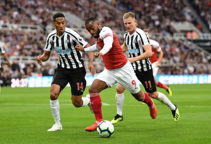 Framed Print : Intense Rivalry: Lacazette vs. Hayden - Arsenal vs. Newcastle, Premier League 2018-19: A Clash of Stars at St. James Park Framed Print : Intense Rivalry: Lacazette vs. Hayden - Arsenal vs. Newcastle, Premier League 2018-19: A Clash of Stars at St. James Park