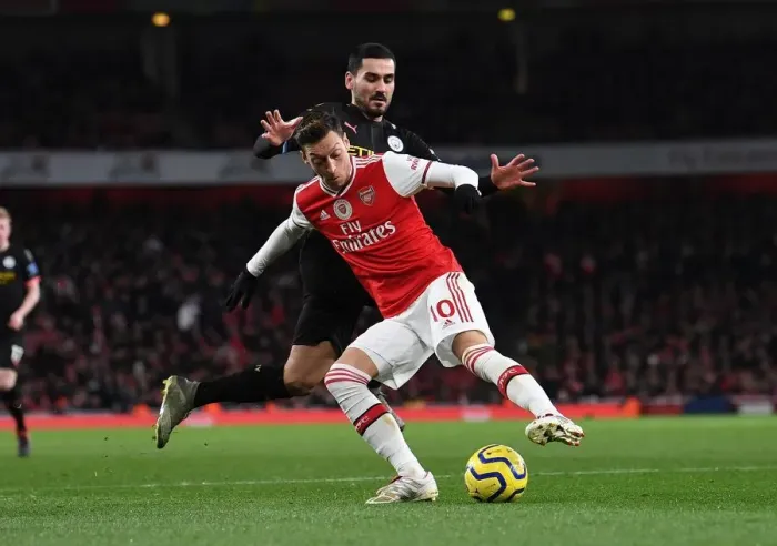 Framed Print : Intense Rivalry: Ozil vs. Gundogan - Arsenal vs. Manchester City Showdown Framed Print : Intense Rivalry: Ozil vs. Gundogan - Arsenal vs. Manchester City Showdown