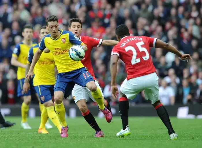Framed Print : Intense Rivalry: Ozil vs. Herrera & Valencia - Battle at Old Trafford (Manchester United vs. Arsenal, Premier League 2014-15) Framed Print : Intense Rivalry: Ozil vs. Herrera & Valencia - Battle at Old Trafford (Manchester United vs. Arsenal, Premier League 2014-15)