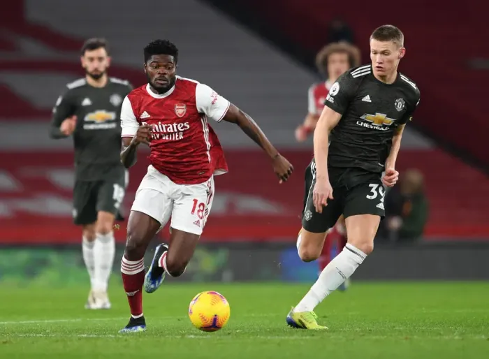 Framed Print : Intense Rivalry: Partey vs McTominay Clash in Empty Arsenal vs Manchester United Premier League Match, 2021 Framed Print : Intense Rivalry: Partey vs McTominay Clash in Empty Arsenal vs Manchester United Premier League Match, 2021