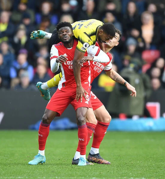 Intense Rivalry: Partey and Xhaka Lock Horns with Emmanuel Dennis in Watford vs. Arsenal