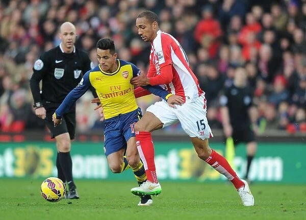 Intense Rivalry on the Pitch: Alexis Sanchez vs. Steven Nzonzi (Stoke City vs. Arsenal, Premier League, 2014)