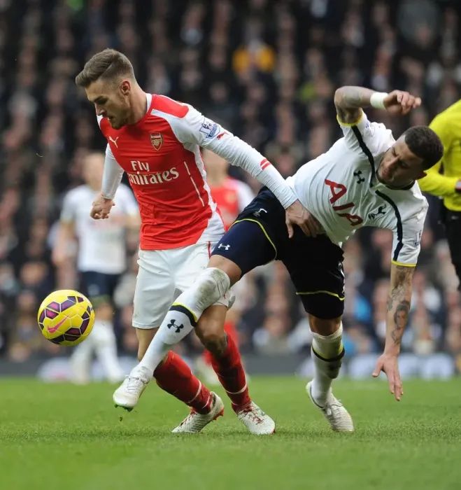 Framed Print : Intense Rivalry: Ramsey Foul - Tottenham vs. Arsenal, Premier League 2014-15