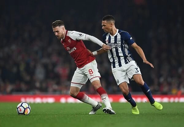 Intense Rivalry: Ramsey Holds Off Gibbs in Arsenal vs. West Brom Clash