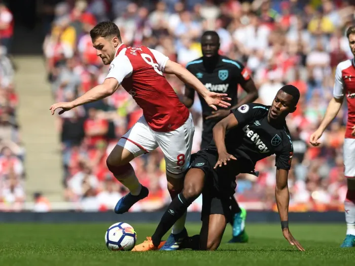 Framed Print : Intense Rivalry: Ramsey vs. Fernandes Clash in Arsenal vs. West Ham Football Match