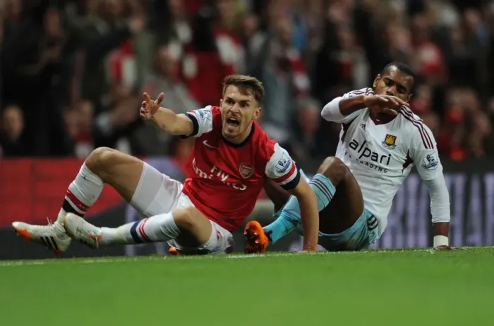 Framed Print : Intense Rivalry: Ramsey vs. Vaz Te Clash at the Emirates