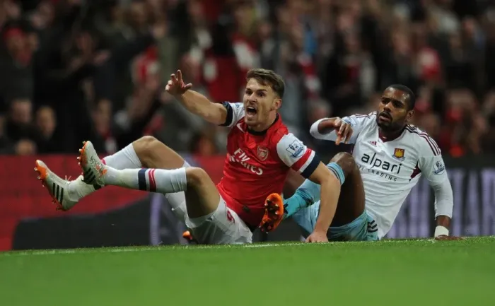 Framed Print : Intense Rivalry: Ramsey vs. Vaz Te Showdown in Arsenal vs. West Ham Premier League Clash Framed Print : Intense Rivalry: Ramsey vs. Vaz Te Showdown in Arsenal vs. West Ham Premier League Clash