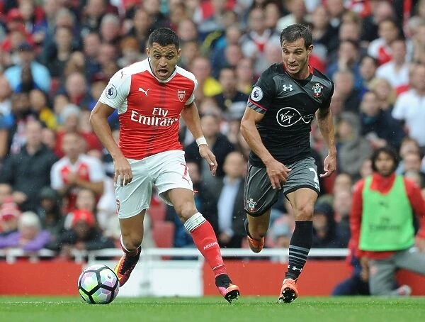 Intense Rivalry: Sanchez vs. Cedric under Pressure in Arsenal vs. Southampton (2016-17)