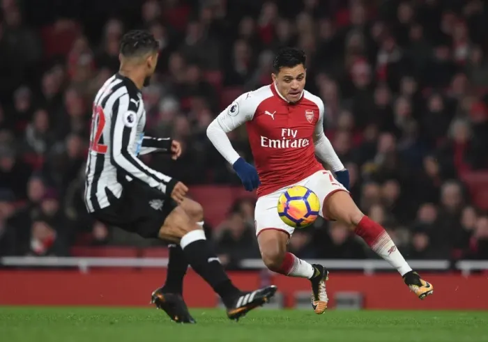 Framed Print : Intense Rivalry: Sanchez vs. Yedlin in Arsenal's Clash with Newcastle United