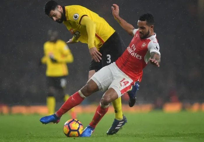 Framed Print : Intense Rivalry: Walcott vs. Britos in Arsenal's Battle Against Watford