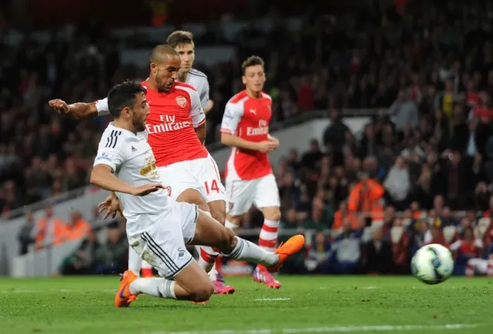 Framed Print : Intense Rivalry: Walcott vs. Taylor at the Emirates - Arsenal vs. Swansea City, Premier League 2014 / 15 Framed Print : Intense Rivalry: Walcott vs. Taylor at the Emirates - Arsenal vs. Swansea City, Premier League 2014 / 15