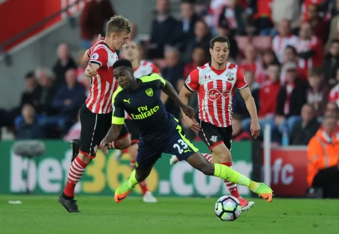 Framed Print : Intense Rivalry: Welbeck vs Ward-Prowse - Southampton vs Arsenal Clash: A Battle on the Field