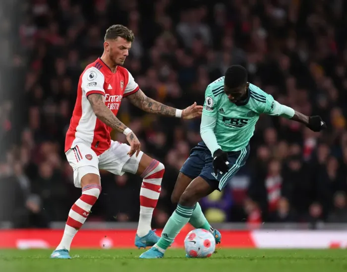 Framed Print : Intense Rivalry: White vs Iheanacho - Arsenal vs Leicester City Battle, Premier League 2021-22 Framed Print : Intense Rivalry: White vs Iheanacho - Arsenal vs Leicester City Battle, Premier League 2021-22