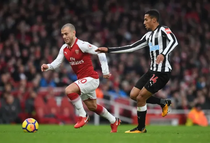 Framed Print : Intense Rivalry: Wilshere vs. Hayden Clash in Arsenal vs. Newcastle Football Match
