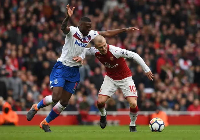 Framed Print : Intense Rivalry: Wilshere vs. Martins Indi, Arsenal vs. Stoke City