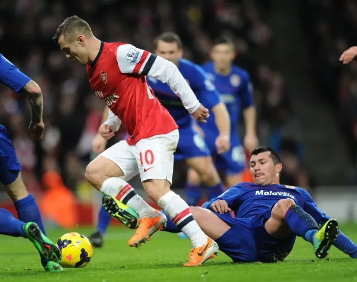 Framed Print : Intense Rivalry: Wilshere vs. Medel - Arsenal's Battle with Cardiff City Framed Print : Intense Rivalry: Wilshere vs. Medel - Arsenal's Battle with Cardiff City