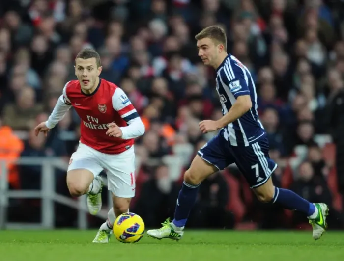 Framed Print : Intense Rivalry: Wilshere vs. Morrison Clash in the 2012-13 Premier League