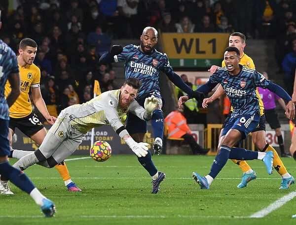 Intense Showdown: Lacazette vs. Sa - Arsenal's Battle at the Goal Line Against Wolves