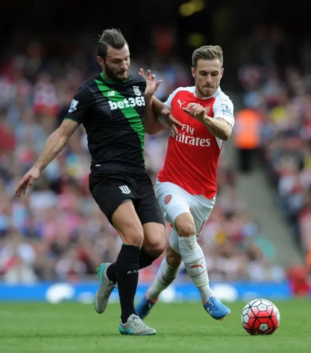 Framed Print : Intense Showdown: Ramsey vs. Pieters in Arsenal's Battle Against Stoke