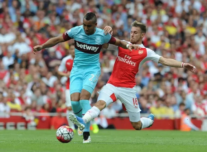 Framed Print : Intense Tackle: Ramsey vs Payet in Arsenal vs West Ham Premier League Clash