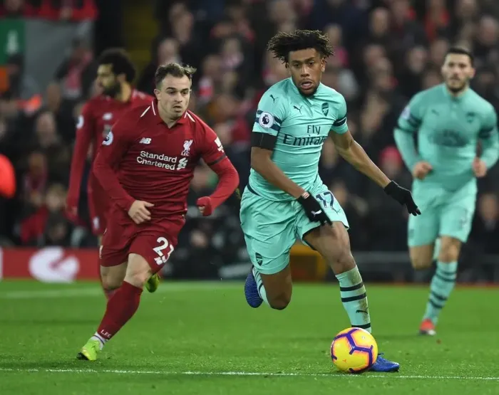 Framed Print : Iwobi Outsmarts Shaqiri: Intense Premier League Clash at Anfield