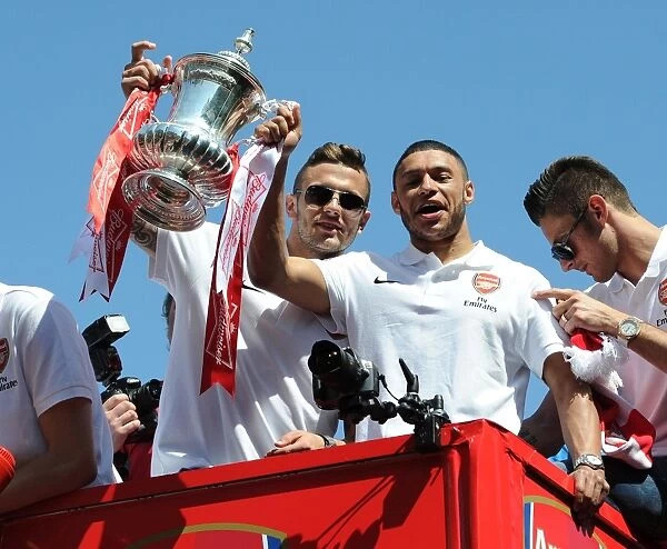 Jack Wilshere and Alex Oxlade-Chamberlain on the Arsenal Trophy Parade. Islington, 18 / 5 / 14