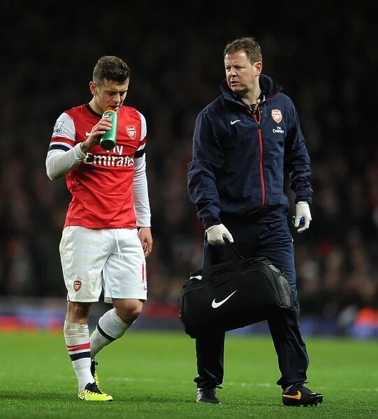 Jack Wilshere (Arsenal) and Arsenal Physio Colin Lewin. Arsenal 1: 1 Everton. Barclays