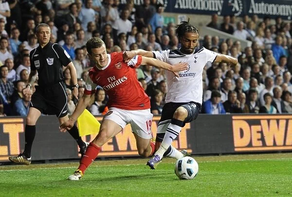 Jack Wilshere (Arsenal) Benoit Assou-Ekotto (Tottenham). Tottenham Hotspur 3:3 Arsenal