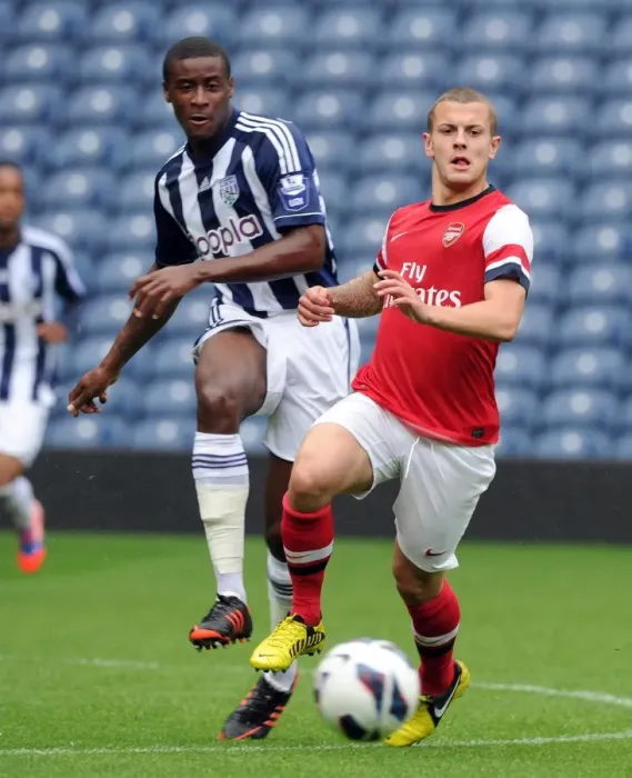 Framed Print : Jack Wilshere (Arsenal) Donervon Daniels (WBA). West Bromwich Albion U21 1: 0 Arsenal U21