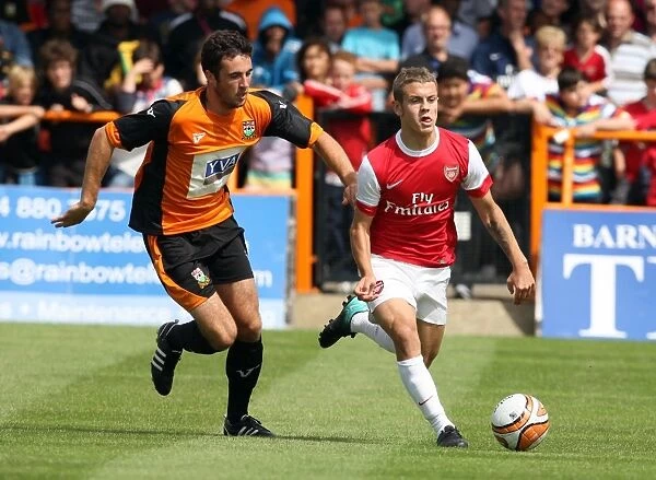 Jack Wilshere (Arsenal) Glenn Poole (Barnet). Barnet 0: 4 Arsenal. Pre Season Friendly
