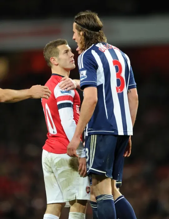 Framed Print : Jack Wilshere (Arsenal) Jonas Olsson (WBA). Arsenal 2: 0 West Bromwich Albion. Barclays