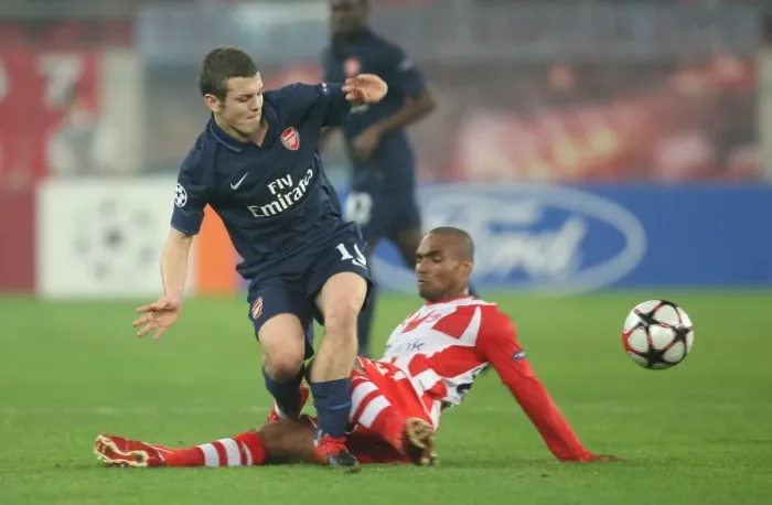 Framed Print : Jack Wilshere (Arsenal) Leonardo (Olympiacos). Olympiacos 1: 0 Arsenal, UEFA Champions League