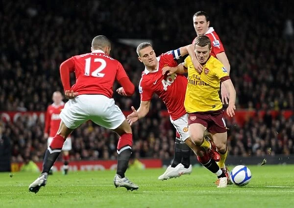 Jack Wilshere (Arsenal) Nemanja Vidic and Chris Smalling (Man Utd). Manchester United 2