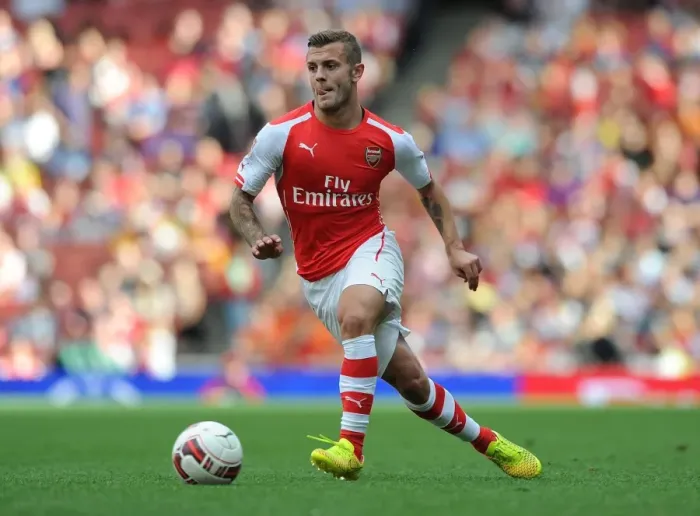 Framed Print : Jack Wilshere: Arsenal's Midfield Maestro in Action against Benfica at Emirates Cup 2014