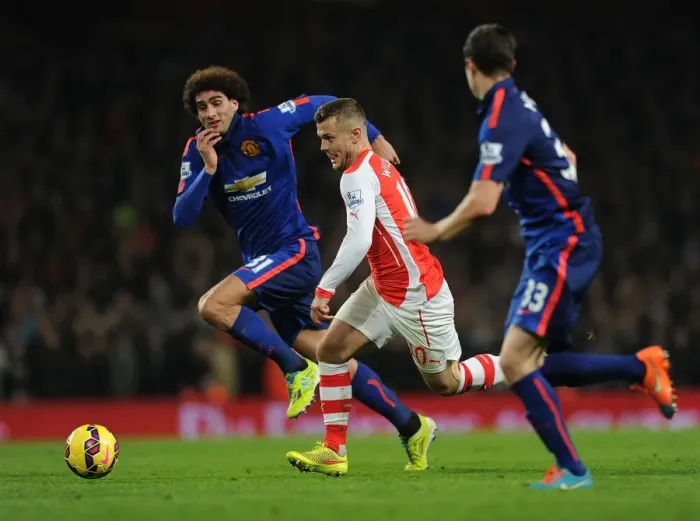 Framed Print : Jack Wilshere Battles Past Fellaini and McNair in Arsenal vs Manchester United Clash (2014-15) Framed Print : Jack Wilshere Battles Past Fellaini and McNair in Arsenal vs Manchester United Clash (2014-15)