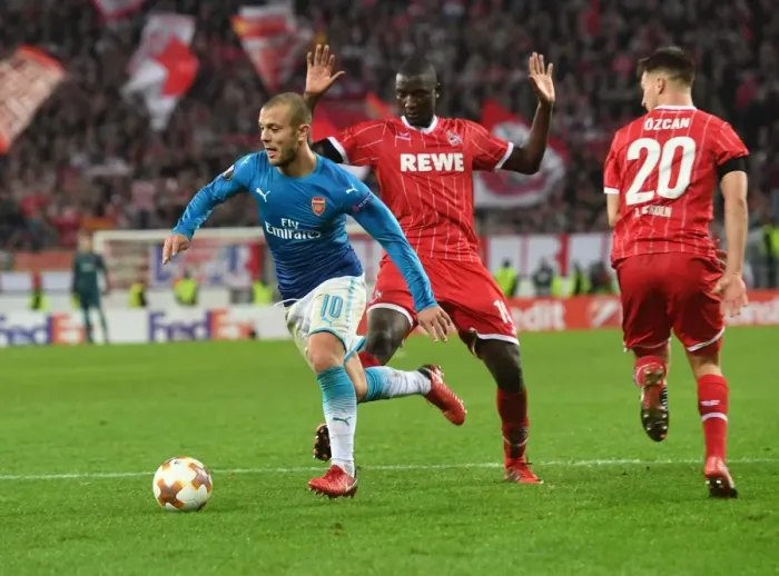 Framed Print : Jack Wilshere Clashes with Guirassy and Ozcan in Arsenal's Europa League Battle against FC Koln