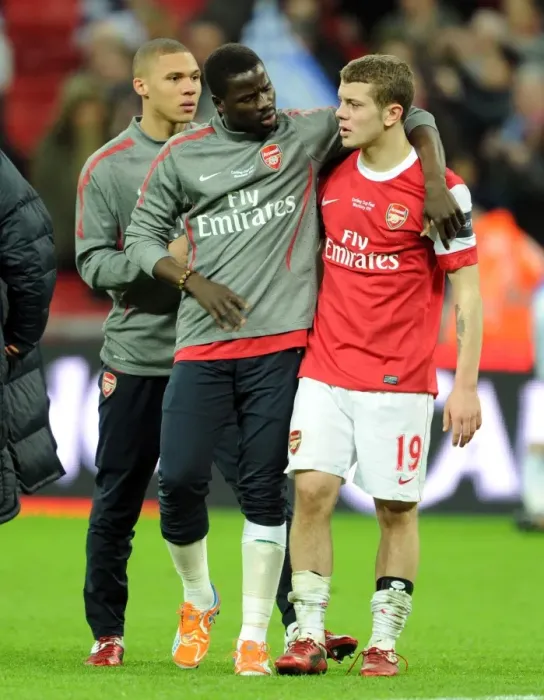 Framed Print : Jack Wilshere is consoled by Emmanuel Eboue (Arsenal) at full time. Arsenal 1
