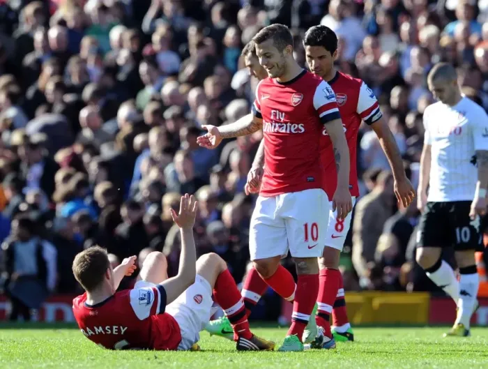Framed Print : Jack Wilshere Consoles Emotional Aaron Ramsey After Fulham vs. Arsenal Clash (2013)