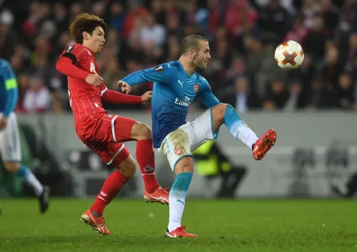 Framed Print : Jack Wilshere Faces Off Against Yuya Osako in UEFA Europa League Clash