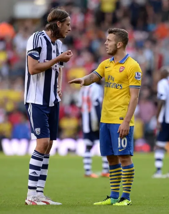Framed Print : Jack Wilshere and Jonas Olsson: A Moment of Respite Amidst the West Bromwich Albion vs. Arsenal Rivalry (2013-14) Framed Print : Jack Wilshere and Jonas Olsson: A Moment of Respite Amidst the West Bromwich Albion vs. Arsenal Rivalry (2013-14)