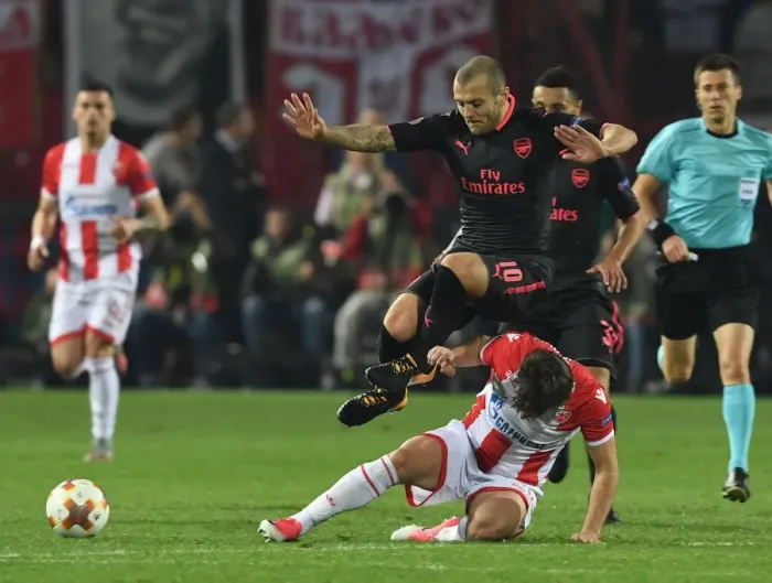 Framed Print : Jack Wilshere Leaps Over Filip Stojkovic in Europa League Clash between Crvena Zvezda and Arsenal Framed Print : Jack Wilshere Leaps Over Filip Stojkovic in Europa League Clash between Crvena Zvezda and Arsenal