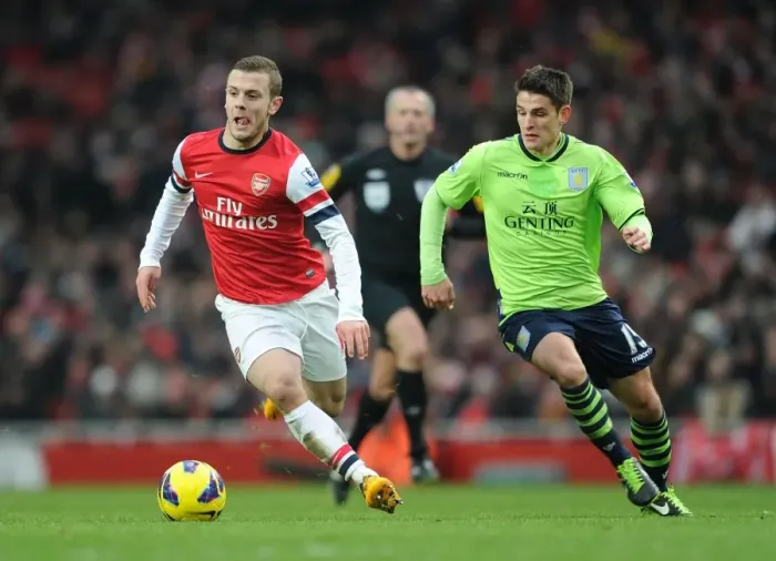 Framed Print : Jack Wilshere Outmaneuvers Ashley Westwood: Premier League Showdown (2012-13)
