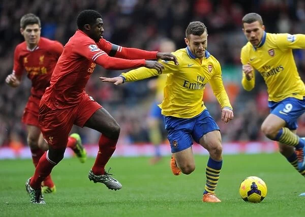 Jack Wilshere Outmaneuvers Kolo Toure: Intense Rivalry in the Premier League Clash between Arsenal and Liverpool