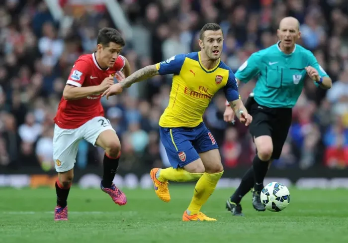 Framed Print : Jack Wilshere Outsmarts Ander Herrera: Intense Premier League Clash between Manchester United and Arsenal (2014-15) Framed Print : Jack Wilshere Outsmarts Ander Herrera: Intense Premier League Clash between Manchester United and Arsenal (2014-15)