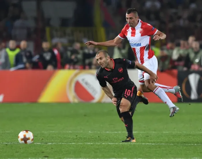 Framed Print : Jack Wilshere Overpowers Nenad Krsticic: Arsenal's Midfield Maestro Shines in Europa League Clash against Crvena Zvezda