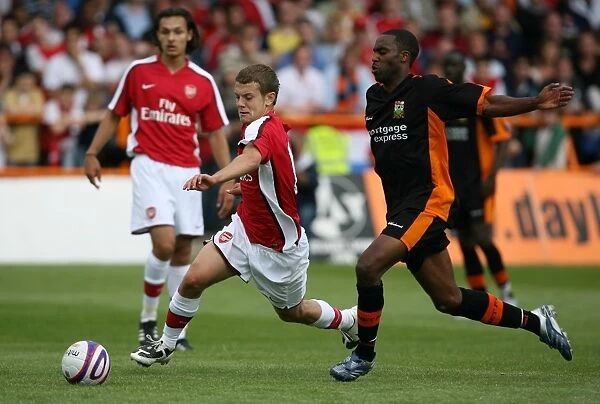 Jack Wilshere Shines: Arsenal's Young Prodigy Outplays Barnet's Justin Cochrane in Pre-Season Friendly